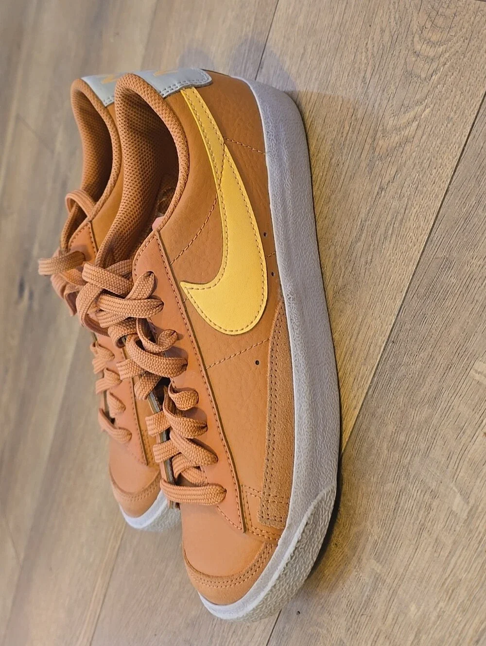 Nike Kids Low-Top Sneakers in Burnt Orange with Yellow Swoosh
